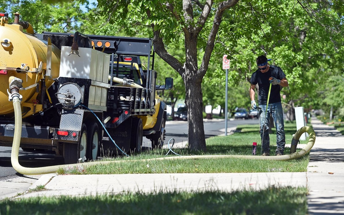 Dorian Conyak with Colorado Boring Co. works to locate utilities Wednesday, May 25, 2022, while working with a crew to install Pulse on the 220 block of west 44th Street in Loveland. (Jenny Sparks/Loveland Reporter-Herald)